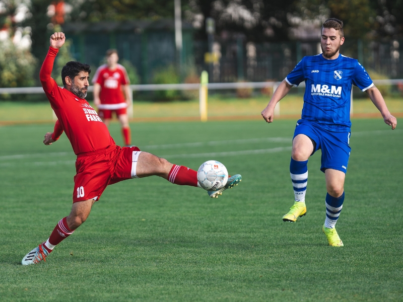 Football team jersey in action as players compete during a match, showcasing custom designs.